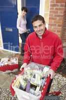 Home Delivery Grocery Driver Unloading Customer's Shopping