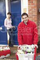 Home Delivery Grocery Driver Unloading Customer's Shopping