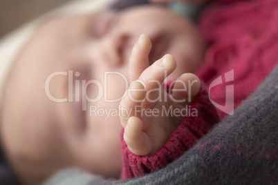 Close Up Of Hand Of Sleeping Newborn Baby Girl