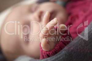 Close Up Of Hand Of Sleeping Newborn Baby Girl