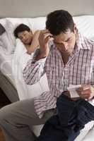 Suspicious Husband Finding Receipt In Wife's Pocket Whilst She S