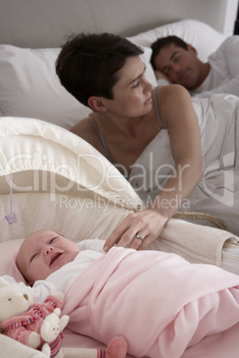 Newborn Baby Crying In Cot In Parents Bedroom
