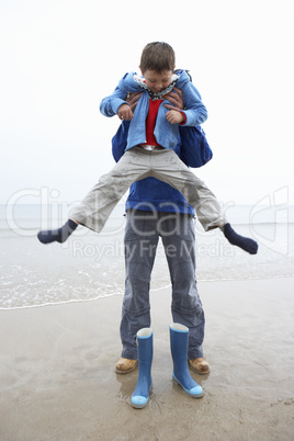 Father and son on beach