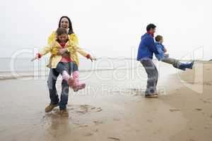 Family playing on beach