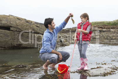 Father with daughter on beach