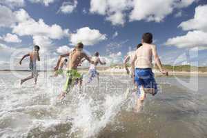 Teenagers playing on beach