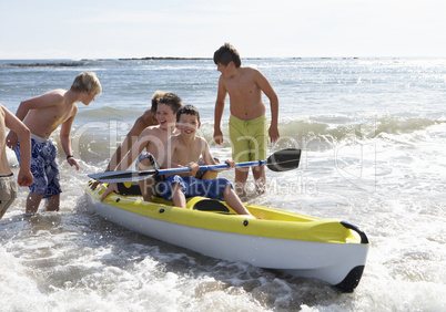 Teenage boys kayaking