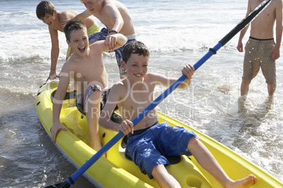 Teenage boys kayaking