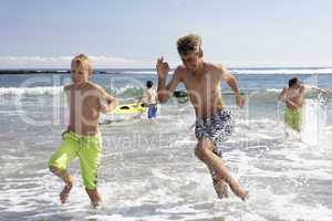 Teenagers playing on beach