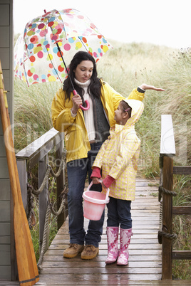 Mother and daughter with umbrella