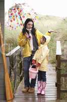 Mother and daughter with umbrella