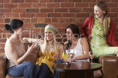 Young women sitting together and talking