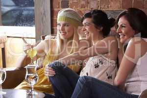 Young women sitting together and talking