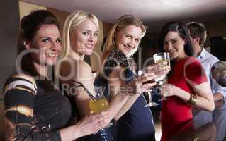 Young women posing at party