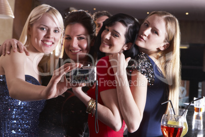 Young women posing at party