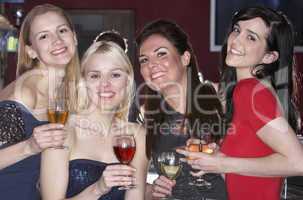 Young women drinking at bar