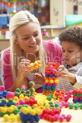 Young woman playing with boy