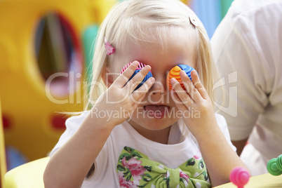 Young girl playing with toys