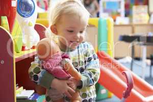 Young girl playing with toys