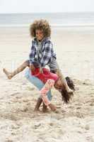 Happy children playing on beach