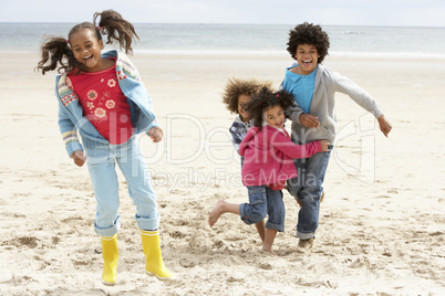 Happy children playing on beach