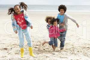 Happy children playing on beach