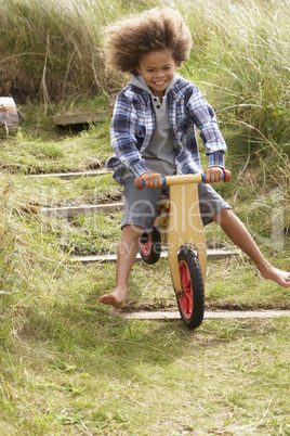 Happy boy riding a bike