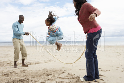 Family playing on beach
