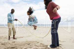 Family playing on beach