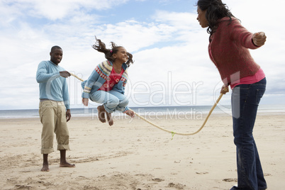 Family playing on beach