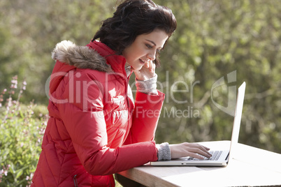 Young woman with laptop computer