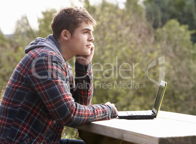 Young man with laptop computer