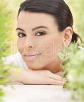 Spa Concept Beautiful Hispanic Woman Smiling in Natural Green Le