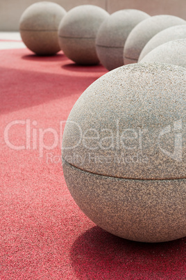 round stones on red ground