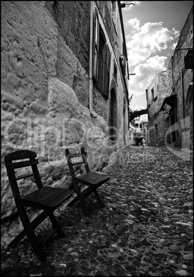 Chairs along an ancient road