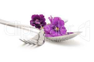 Spoon and fork with violets