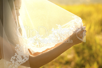 Bride under veil.