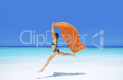 bikini girl is jumping up in the air