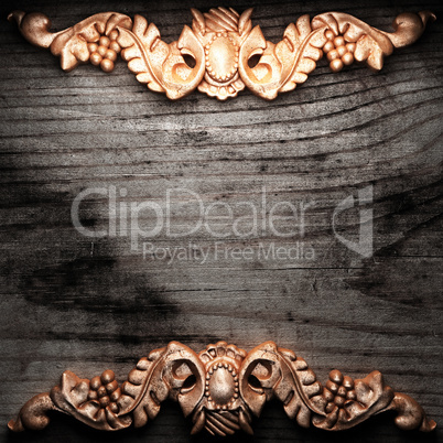 golden ornament on wood