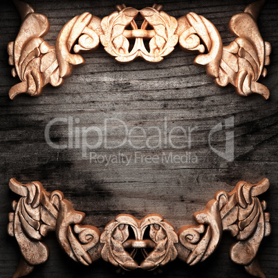 golden ornament on wood