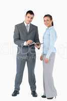 Business team with clipboard against a white background