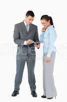 Business partner analyzing documents against a white background