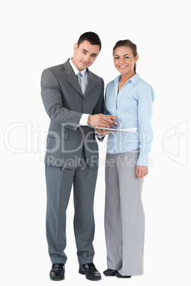 Business partner with clipboard against a white background