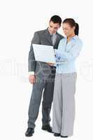 Business partner looking at a notebook against a white backgroun