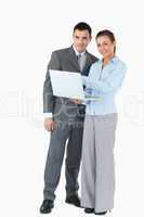 Business partner with laptop against a white background