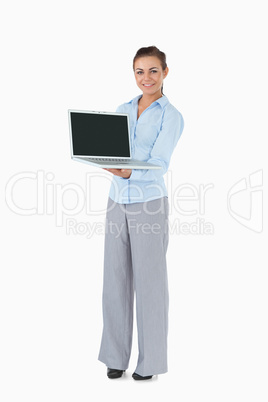 Businesswoman with laptop against a white background