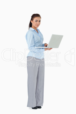 Businesswoman with her laptop against a white background