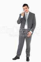 Businessman with headset on against a white background