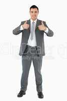 Smiling businessman giving thumbs up