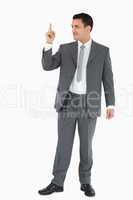 Businessman pointing up